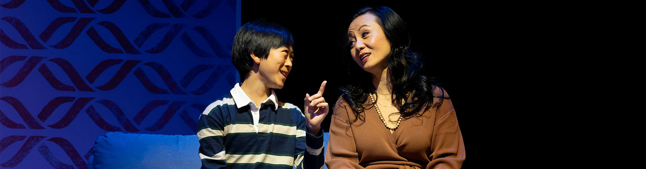 Rickie Wang and Sharon Crandall in Elf: The Musical, 2023: set design by Brian Ball; costume design by Christine Reimer; lighting design by Itai Erdal; photo by Moonrider Productions for the Arts Club Theatre Company