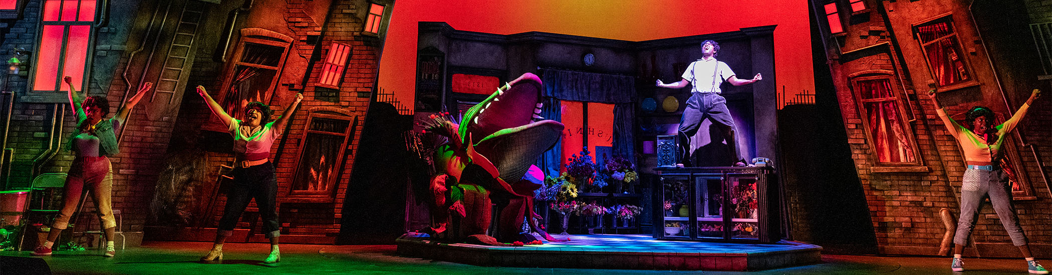 Rochelle Laplante, Ali Watson, Tenaj Williams, and Ivy Charles in Little Shop of Horrors, 2023: set design by Beyata Hackborn; costume design by Carmen Alatorre; lighting design by Rebecca Picherack; photo by Moonrider Productions for the Arts Club Theatre Company