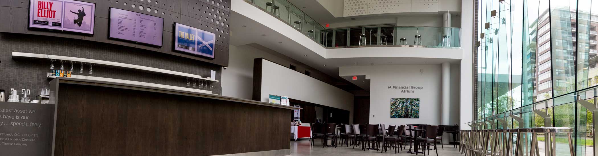 Photo of the BMO Theatre Centre atrium, with the bar and seating throughout.