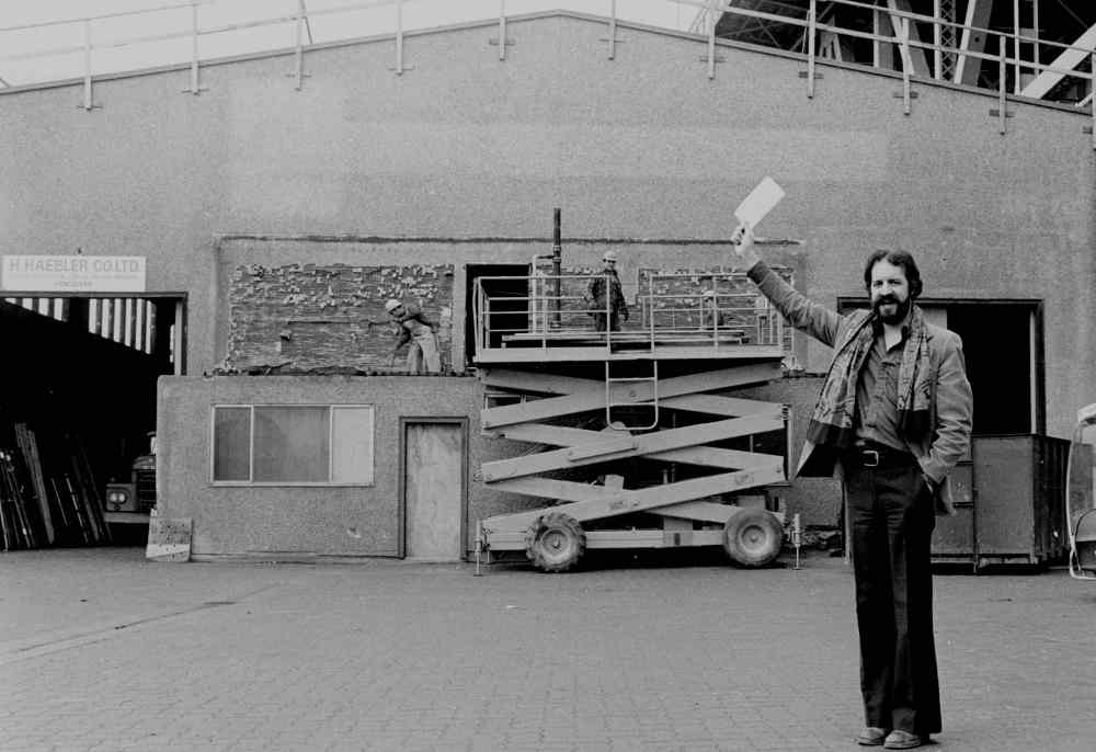 Bill Millerd, with cheque in hand, oversees the Granville Island Stage’s construction