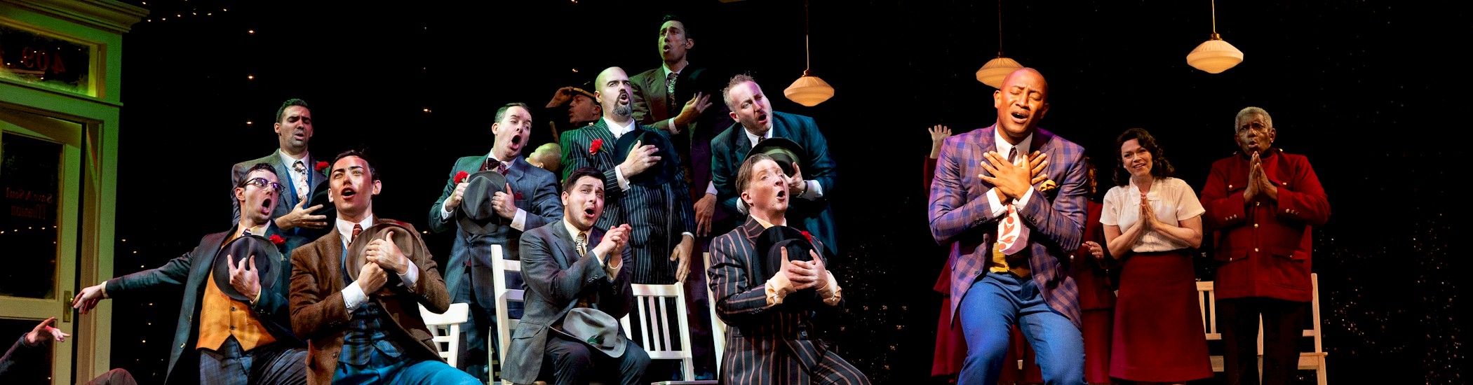 Cast of Guys & Dolls, 2024; set design by Scott Penner; costume design by Christine Reimer; lighting design by Gerald King; photo by Moonrider Productions for the Arts Club Theatre Company