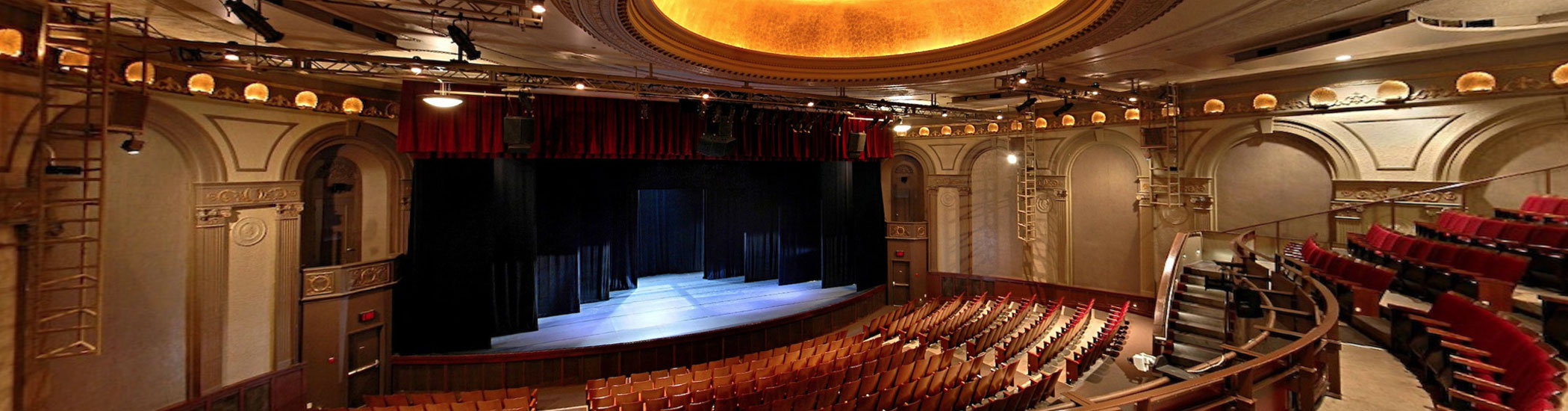 Photo of the Stanley Stage interior. The bright lights are on and the room is empty.